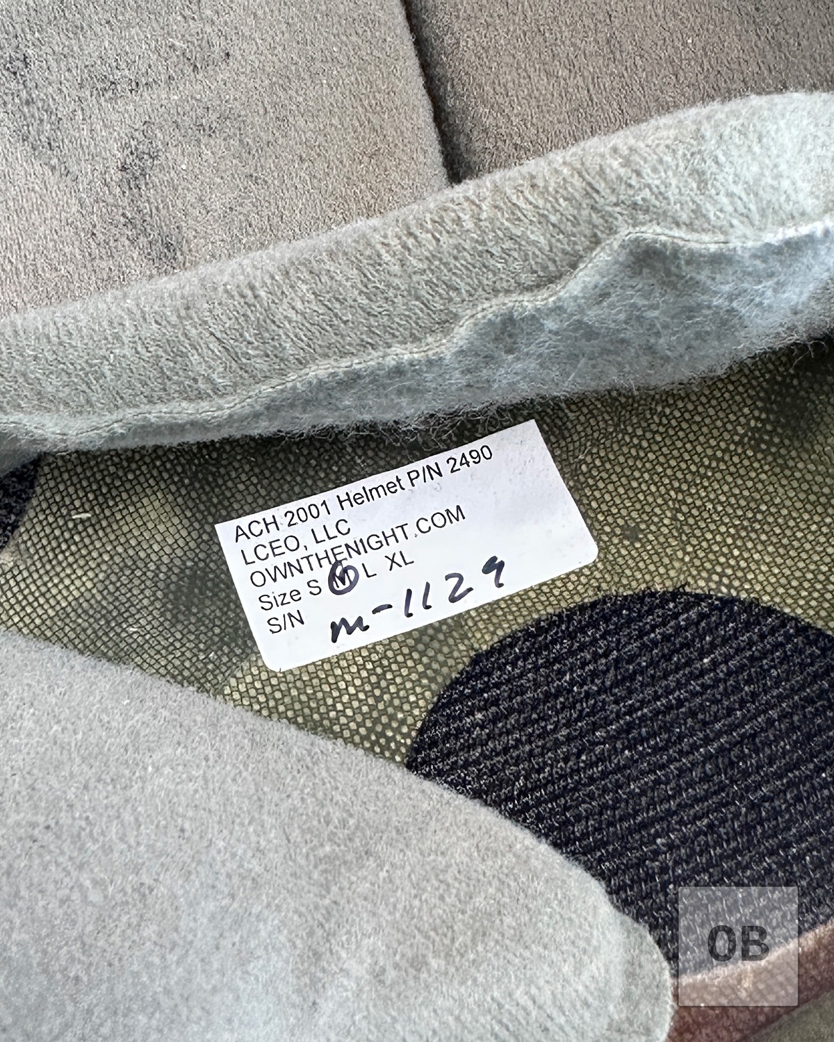 Manufacturer's label inside ACH 2001 high-cut helmet.