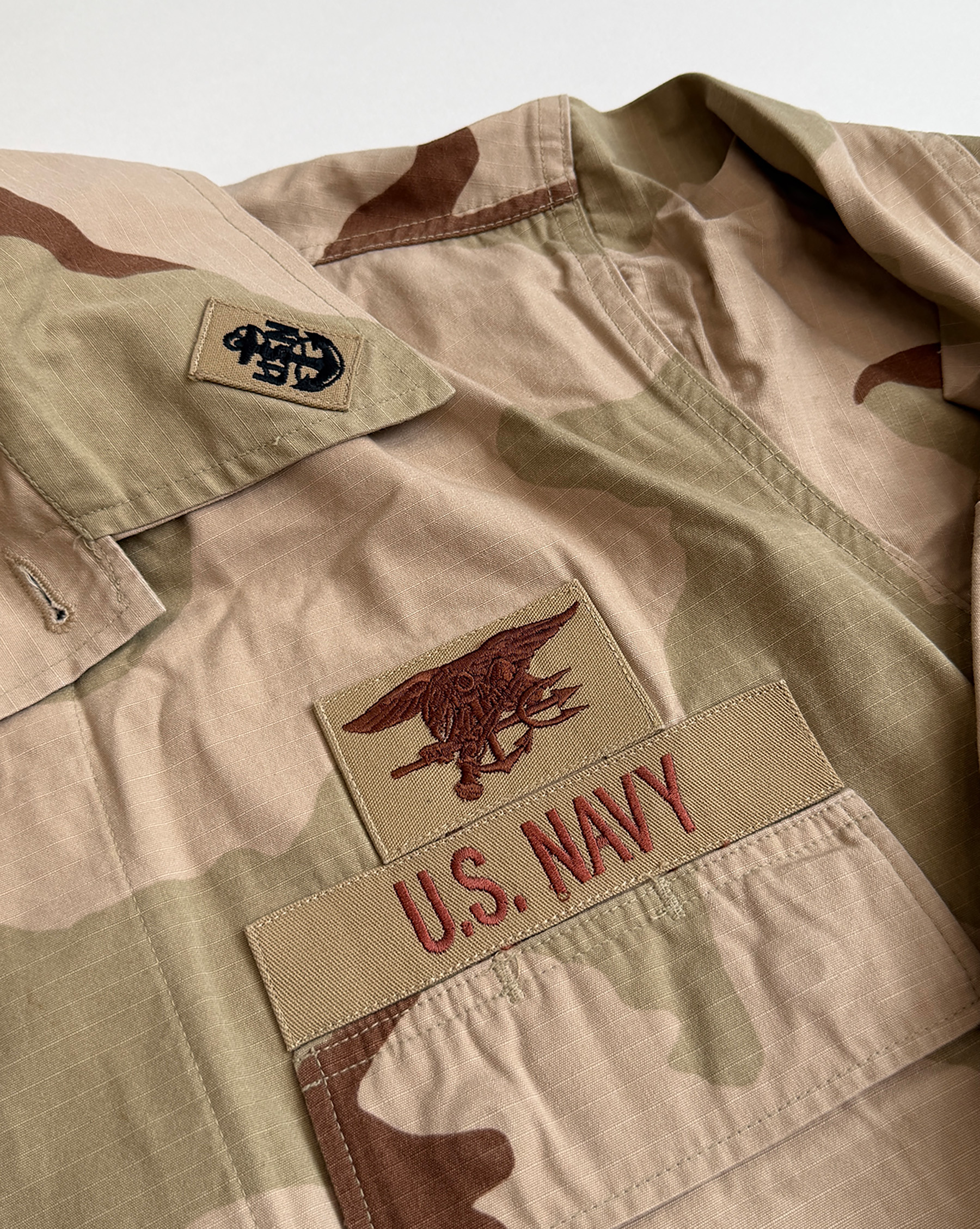 Interior care label showing the garment nomenclature and the 1997 defense contract number SP0100-97-D-C811.
