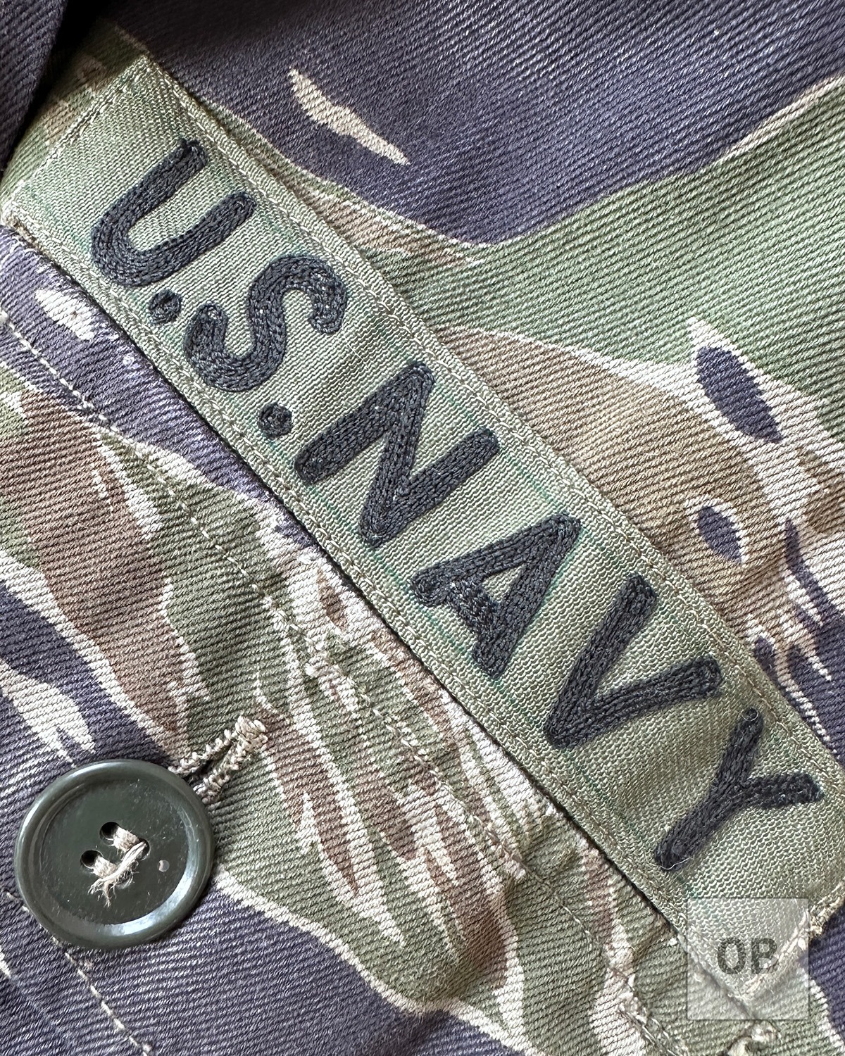 Detail of chain-stitched U.S. Navy tape added by a Vietnamese tailor.