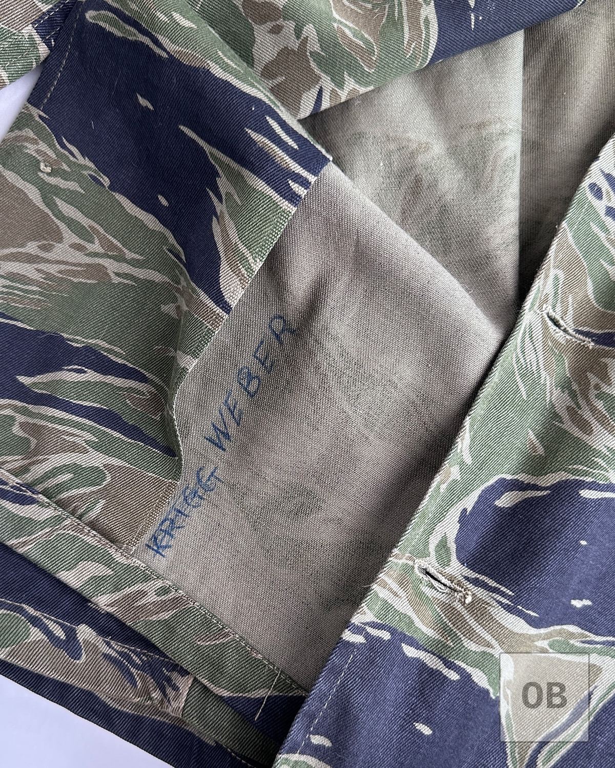 Interior ink markings inside the jacket, including Weber's name.