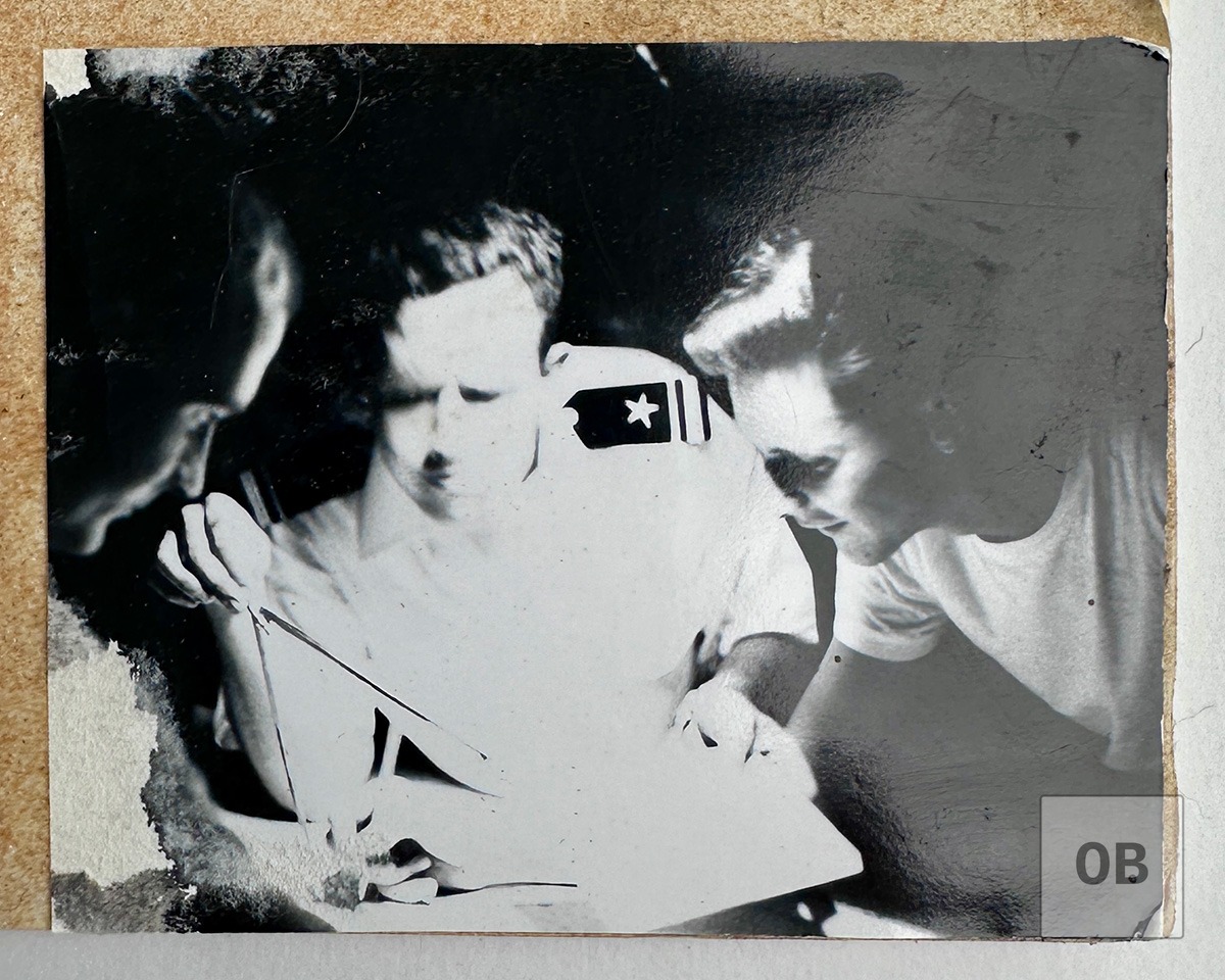 Photograph of Weber reading a map during his Vietnam tour.