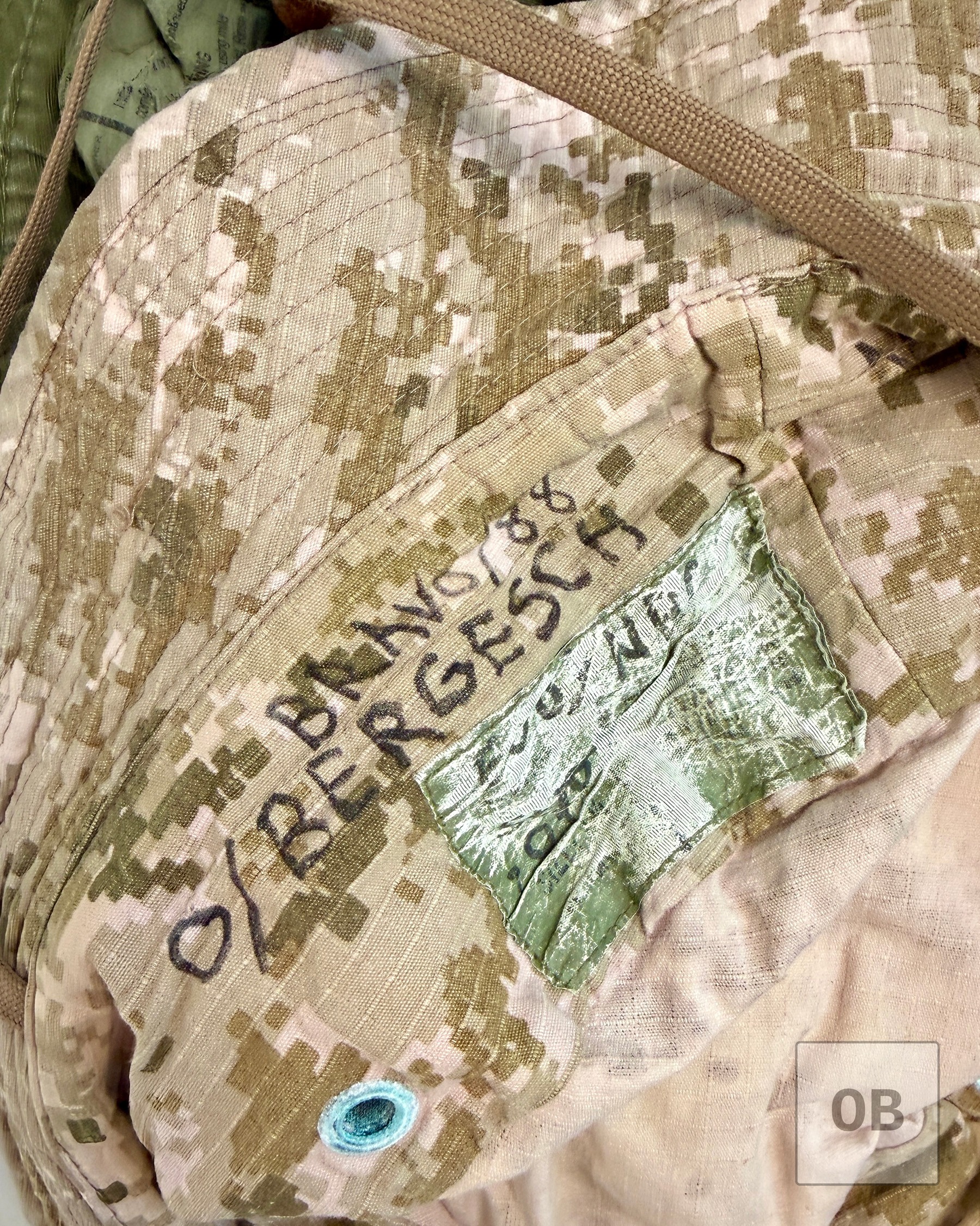 A handwritten surname and the designation Bravo / 88 written in black marker inside the AOR1 hat's crown.