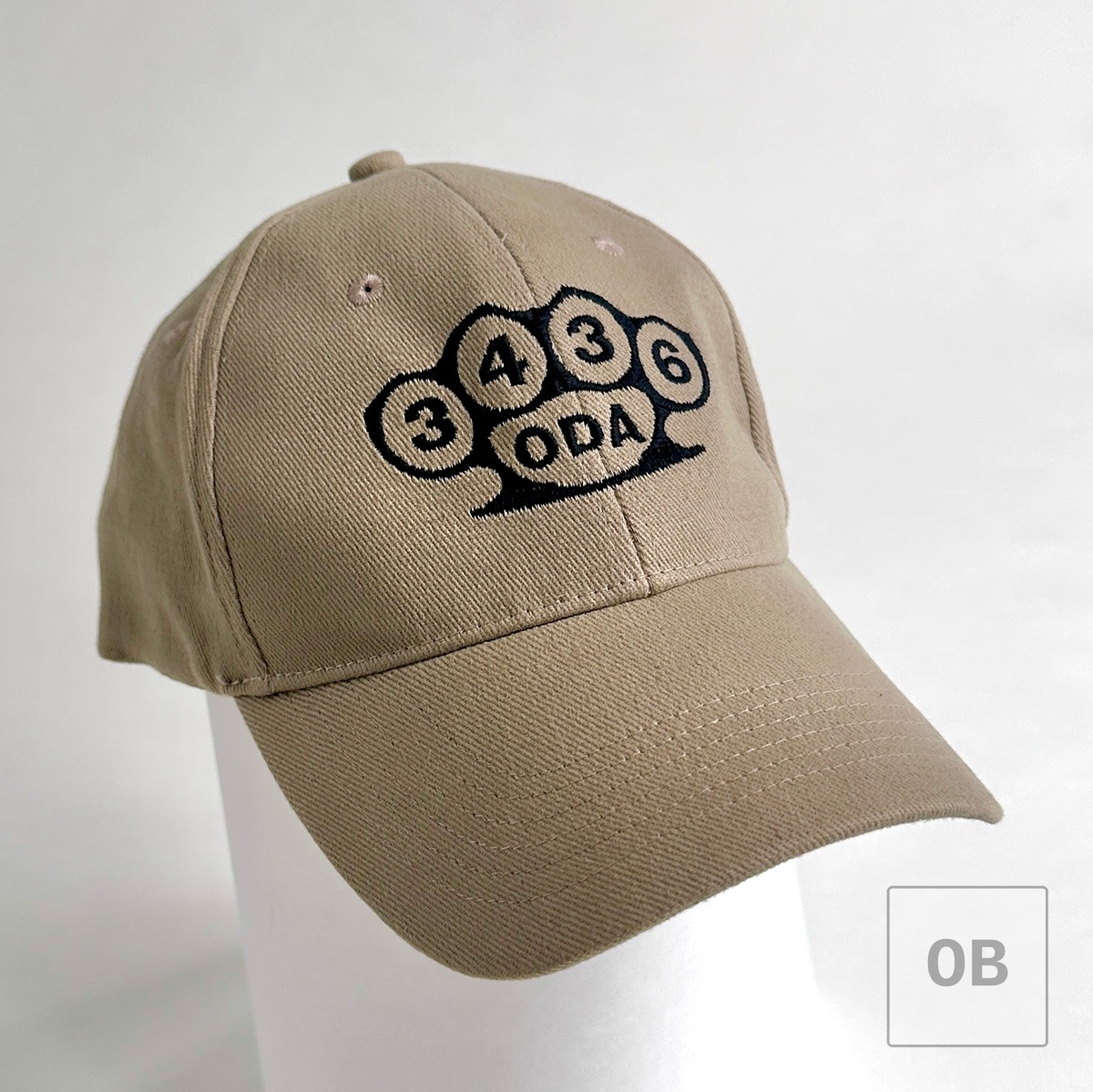 Front view of the ODA 3436 Special Forces team cap featuring an embroidered brass knuckle motif surrounding the four-digit ODA designation.