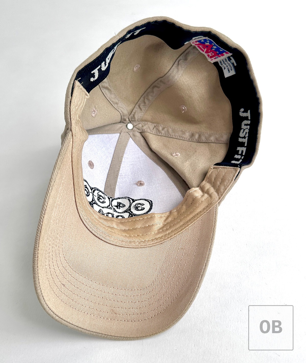 Interior of the ODA 3436 Special Forces team cap showing the sweatband, rolled brim, manufacturer's label, and evidence of use.