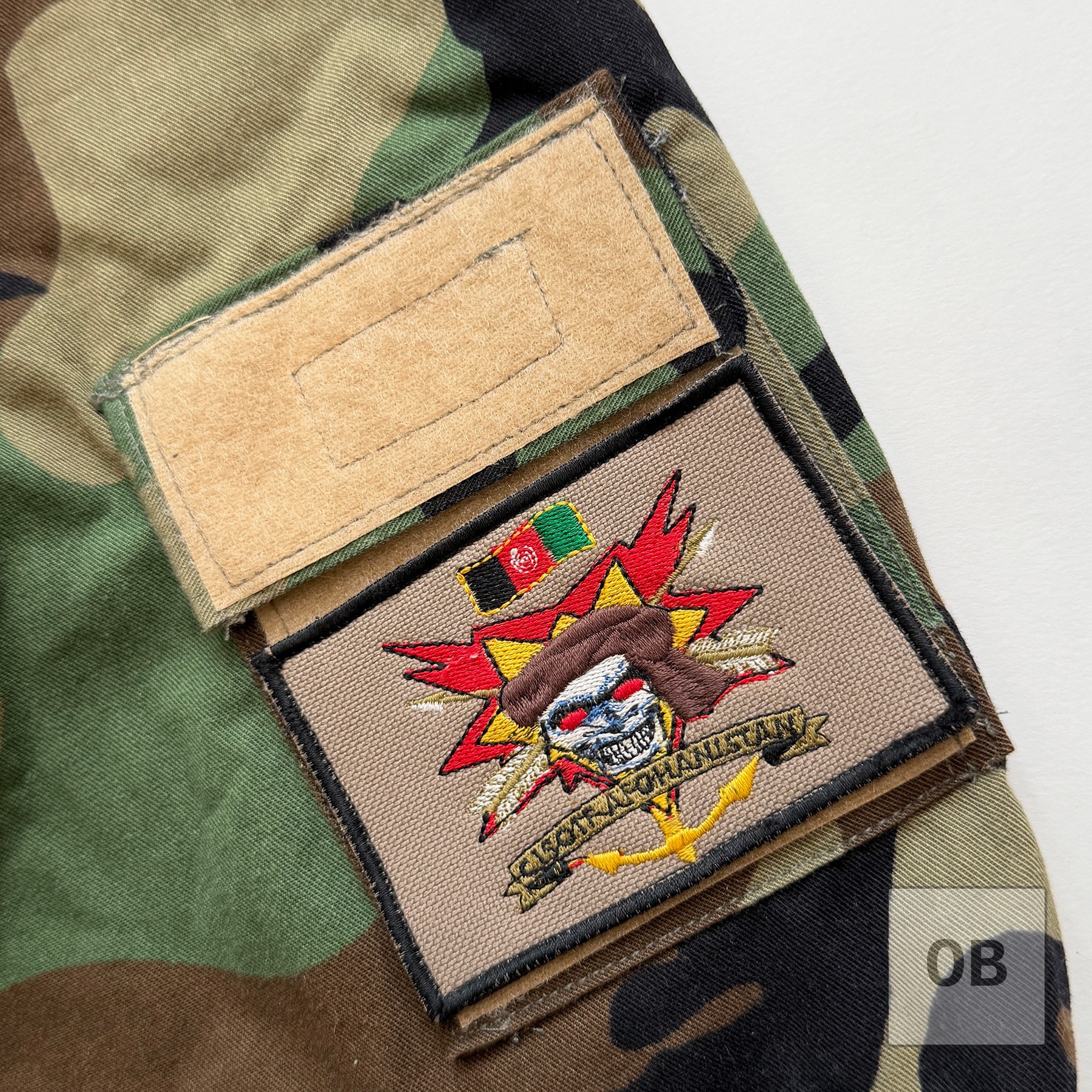 CJSOTF-A (Afghanistan) patch with hook-back, bearing the Afghan flag, on the combat top's sleeve.