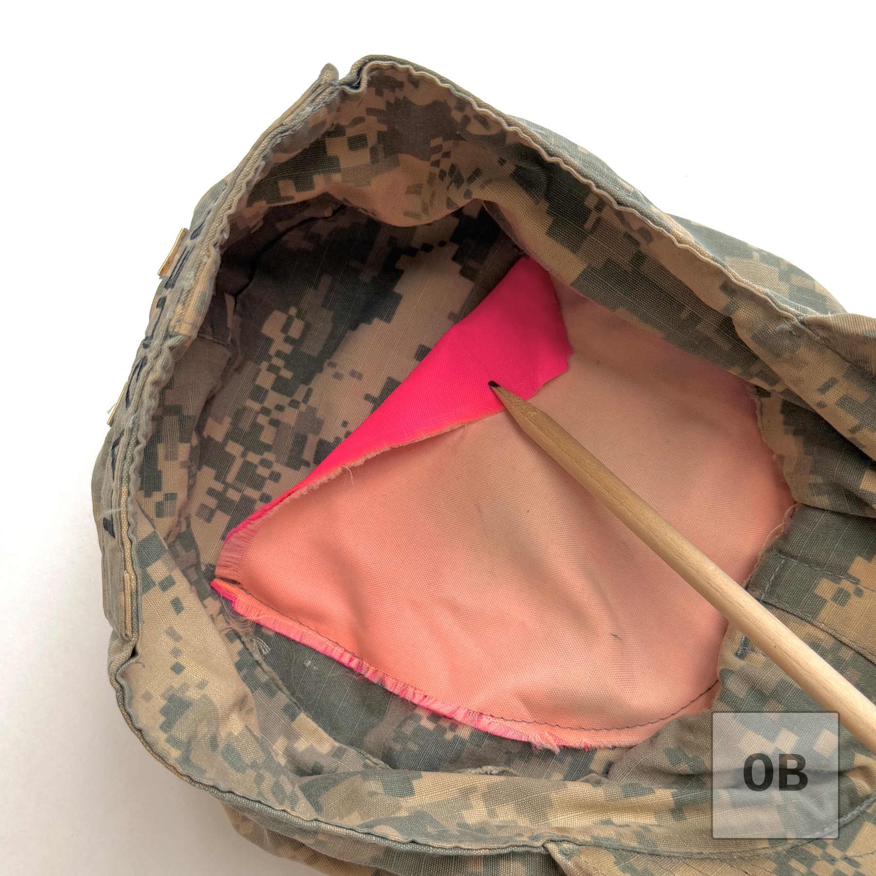 Close-up of the cut-down VS-17 panel marker fabric sewn into the crown as a pocket.