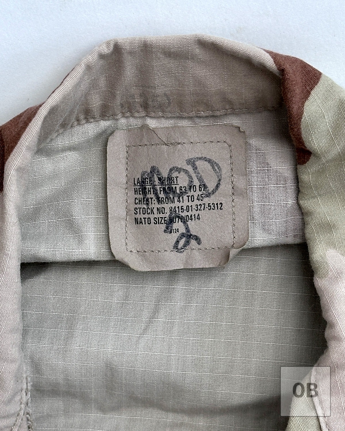 Interior collar tag reading "MOD 2" handwritten in black marker, with the original size and NATO stock number printed beneath.