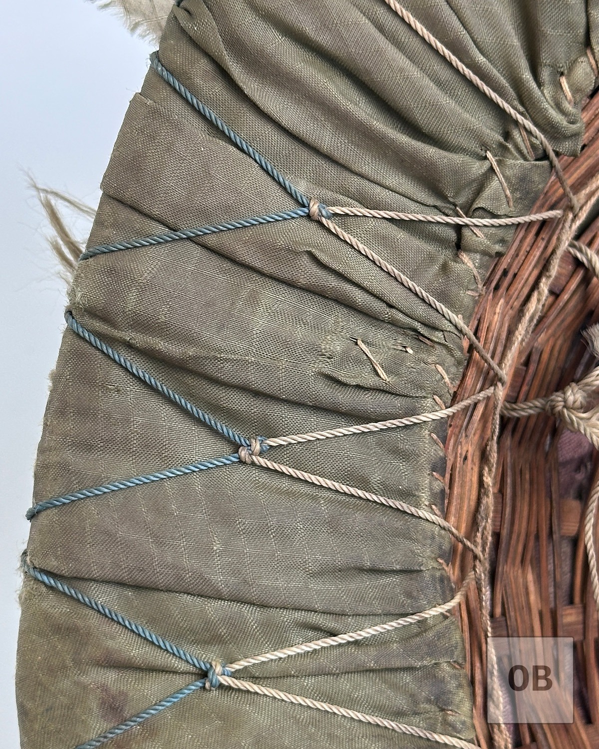 Close-up of fishnet camouflage with differing cord on an early Viet Cong camouflage helmet.