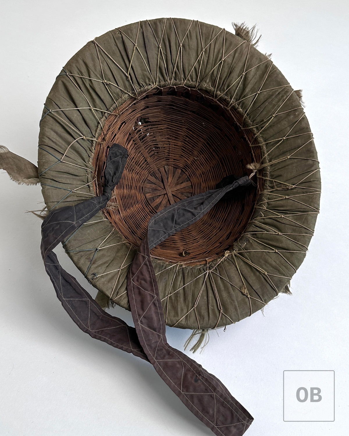 Interior of an early Viet Cong hand-woven reed camouflage helmet.