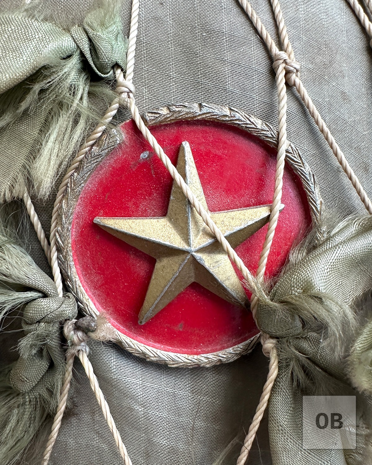 Close-up of the early Viet Minh badge on a Viet Cong camouflage helmet.