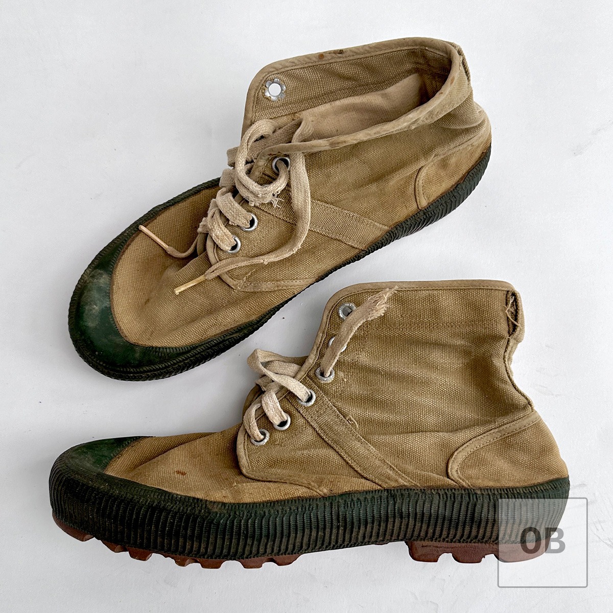 North Vietnamese jungle boots showing the molded rubber sole and early khaki canvas construction.