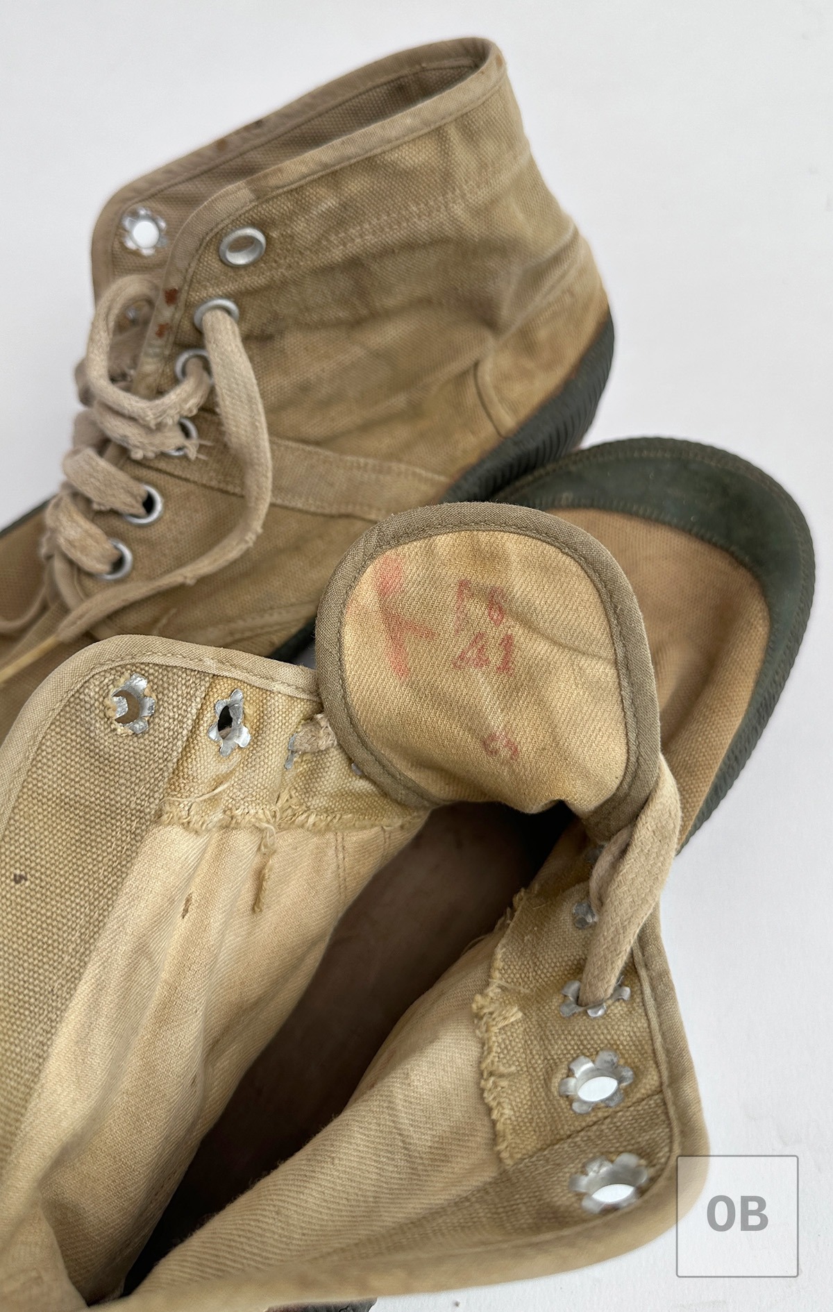 North Vietnamese jungle boots showing the original red ink size stamp on the tongue.