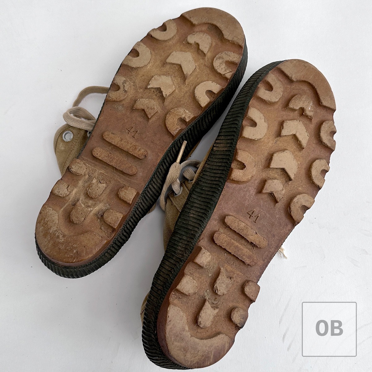 North Vietnamese jungle boots showing soil still packed in the original tread pattern.
