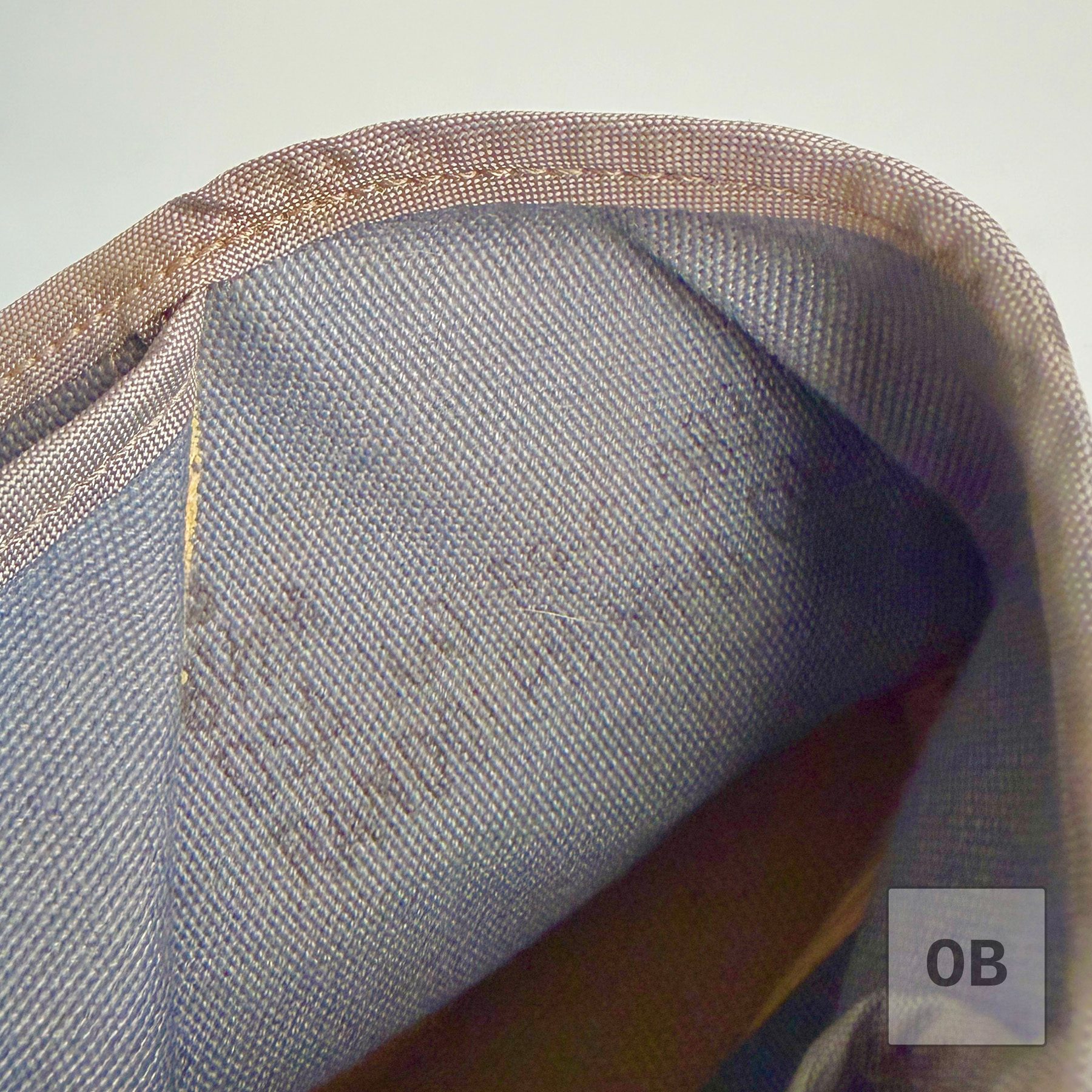 Interior of a Vietnam-era UDT coral bootie from a SEAL Team 1 uniform group with a faint 1969 date on the canvas lining.