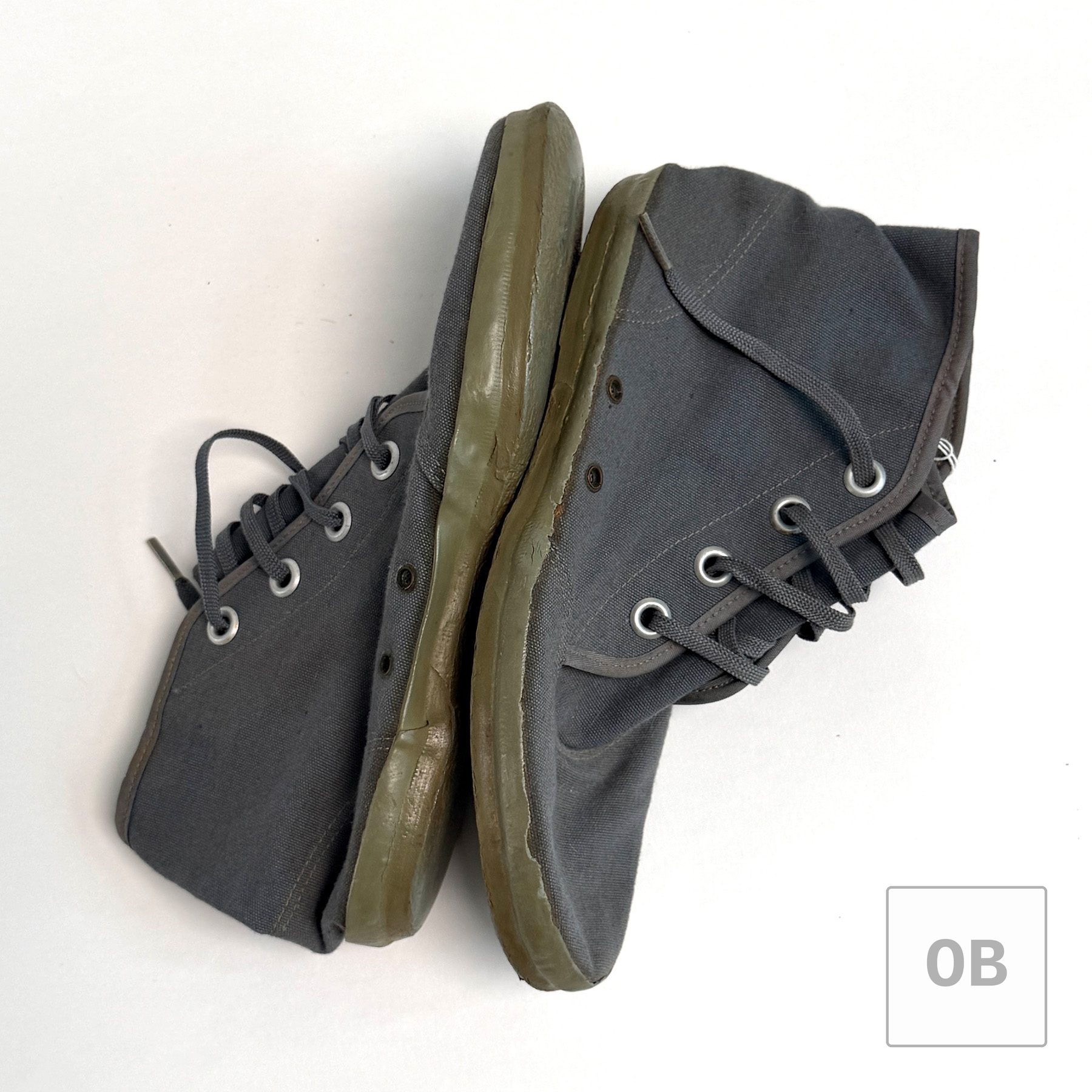 Vietnam-era UDT coral booties from a Navy SEAL Team 1 uniform group, grey canvas with concave vent grommets and zinc eyelets, 1969-dated.