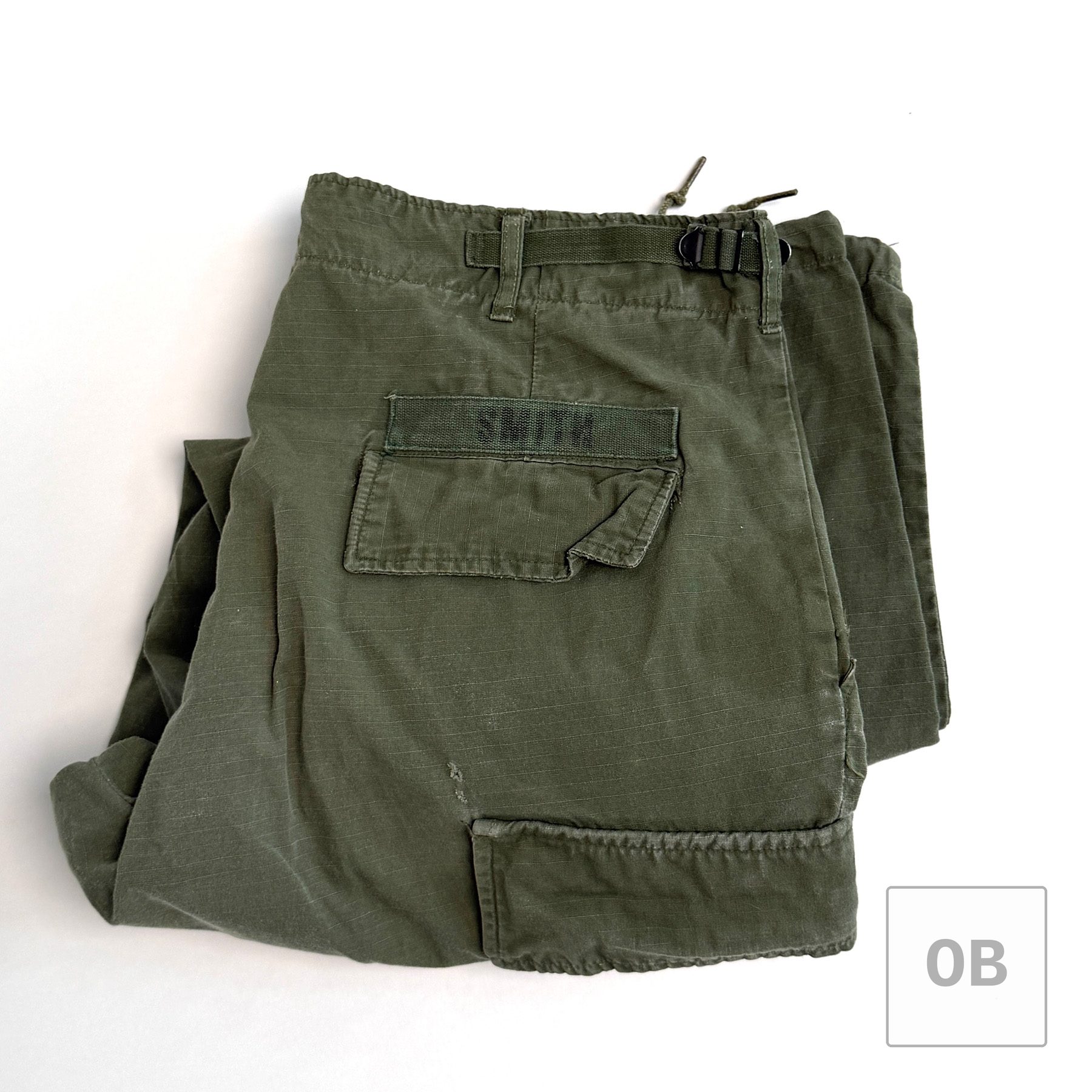 Vietnam War Navy SEAL Team 1 OD jungle trousers, 1967-dated, with a printed SMITH tape above the rear pocket.