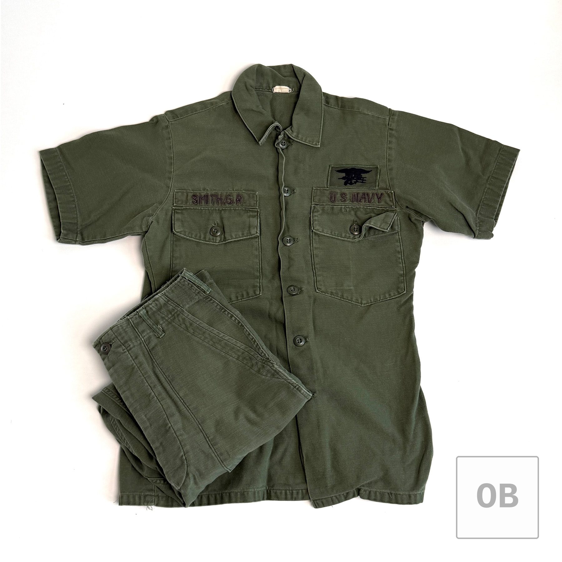 Navy SEAL Team 1 OD utility shirt and trousers, 1972-dated, with SMITH, G.R. and U.S. NAVY tapes and a SEAL Trident.