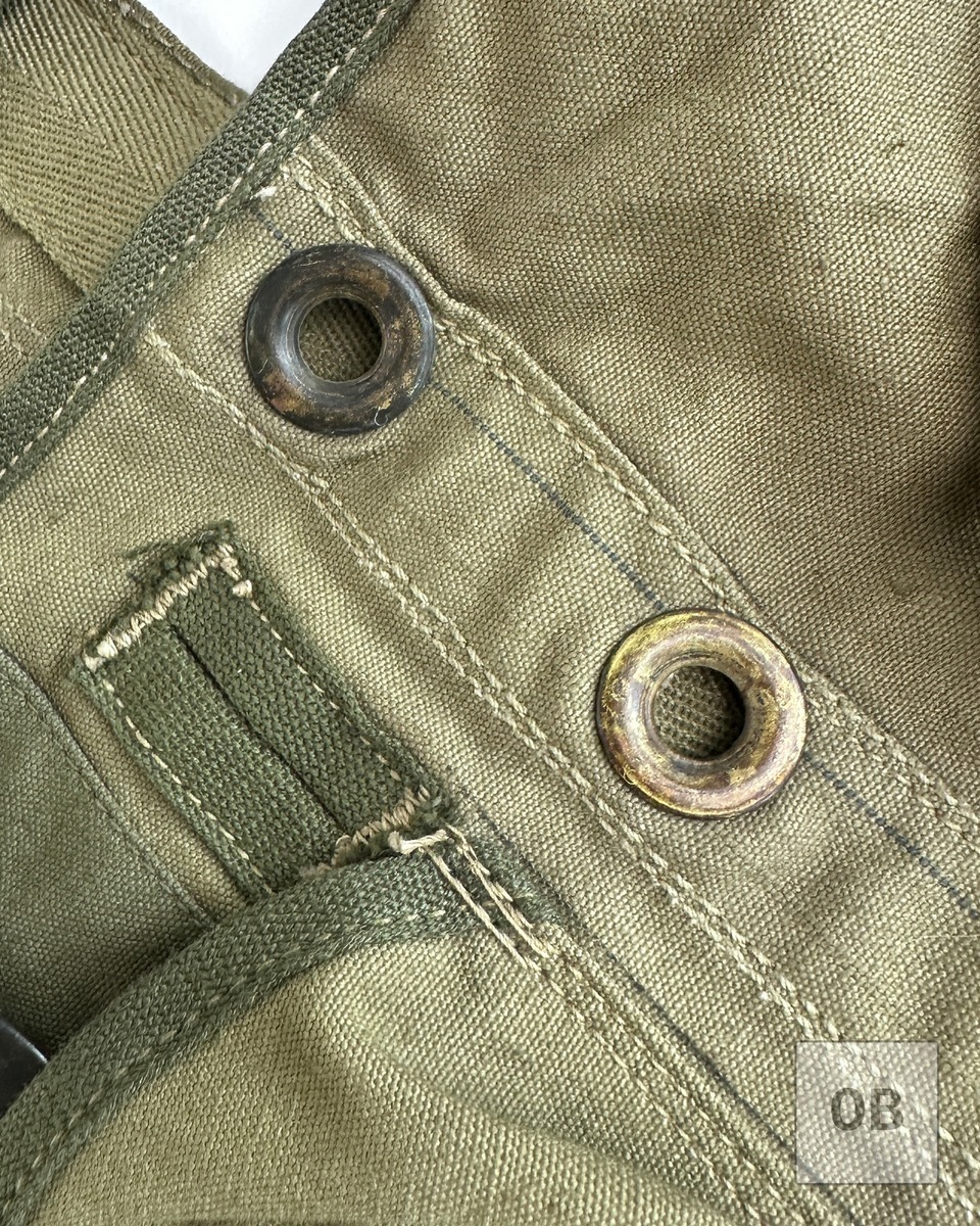 WWII assault vest brass waist grommets webbing strap edge oxidation tracer yarn detail
